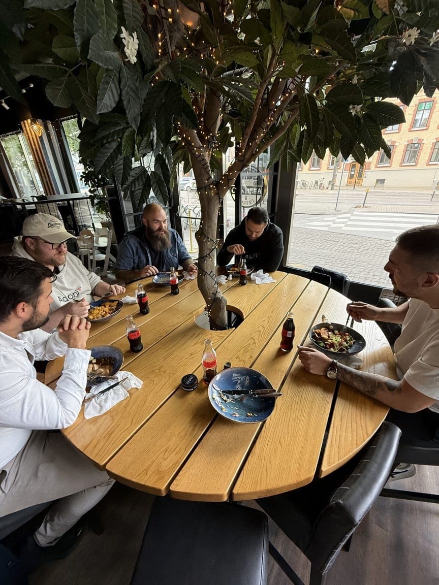 Aidoni colleagues having lunch together